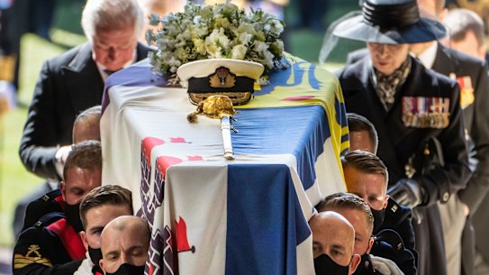 Pall bearers carry Prince Philip’s coffin into St George’s Chapel.