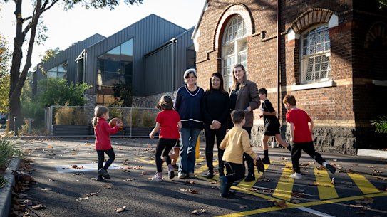 St Kilda Primary School grandparents Jenny Brew and parents Caroline Thornton and Selina Ife with their children and grandchildren outside St Kilda Primary School.