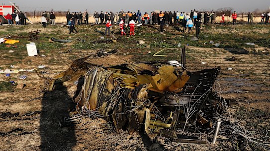 Debris is seen from a plane crash on the outskirts of Tehran, Iran on Wednesday, after a Ukrainian aircraft carrying 176 people crashed shortly after take-off from the city's main airport, killing all on board.