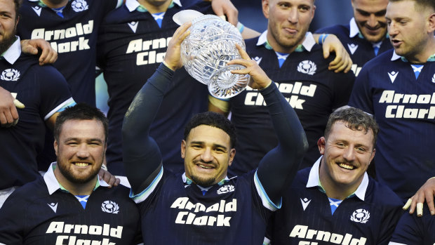 Scotland’s Sione Tuipulotu raises the Hopetoun Cup trophy.
