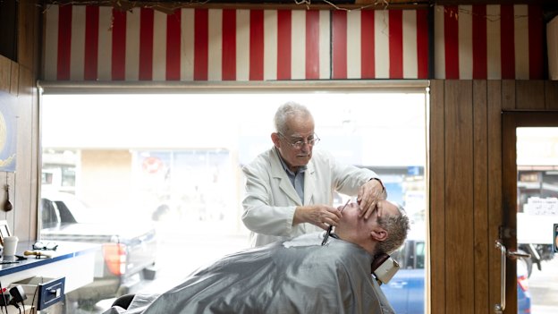 Frank Apostolopoulos has been cutting hair on High Street in Northcote for almost 50 years.