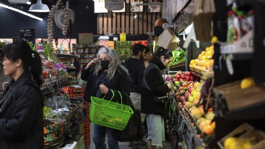 Shoppers browse the fruit and vegetable stalls at South Melbourne market earlier this month.