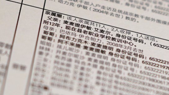 Details from a leaked database that offers an insight into how Chinese officials decide who to put into detention camps. The text reads: "Family circle: Total relatives 11, 2 imprisoned, 1 sent to training, Father: Memtimin Emer ... sentenced to 12 years [and] is now in the training centre at the old vocational school." 