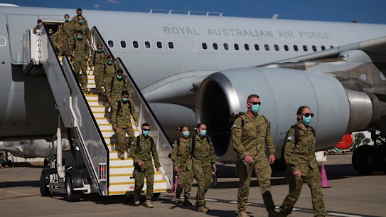 ADF personnel arriving at Tullamarine on Friday afternoon.
