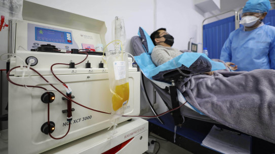Dr Kong Yuefeng, a recovered COVID-19 patient, donates plasma in the blood centre in Wuhan. 