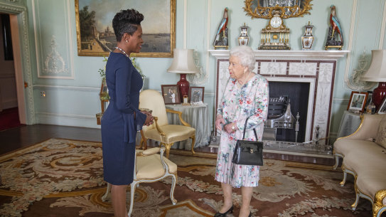 Queen Elizabeth II meets the Commissioner for Grenada, Lakisha Grant, at Buckingham Palace on Tuesday.