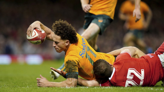 Australia’s Mark Nawaqanitawase scores his second try of the game during the rugby union international match between Wales and Australia at the Principality Stadium in Cardiff, Wales, Saturday, Nov. 26, 2022. (David Davies/PA via AP)