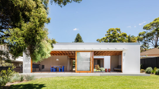 The living and dining quarters open to a generous garden.