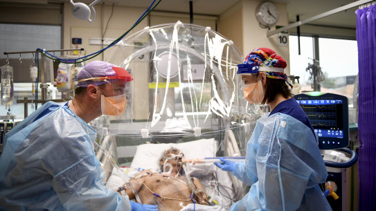 Doctors treating a patient in the ICU ward of Western Health's Footscray Hospital in Melbourne.