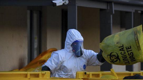 Clinical waste removalists  at the St. Basil's Homes for the Aged Care in Victoria on Saturday.