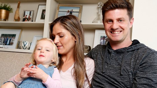 All clear: Emily McQualter, now two, with her parents Jane and Andrew.