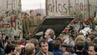 West Berliners watch East German border guards open up a new crossing point in the Berlin Wall in 1989. 