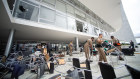 Workers clear debris caused by radical supporters of former President Jair Bolsonaro following a riot at Planalto Palace.