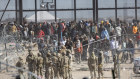 Out of control: Immigrants breach the Rio Grande barrier in El Paso, Texas. 