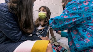 Alejandra Gerardo, 9, gets the first of two Pfizer COVID-19 vaccinations during a clinical trial for children at Duke Health in North Carolina in the United States.