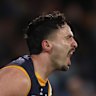 Izak Rankine celebrates a huge goal in the second quarter of their thriller against Collingwood. 