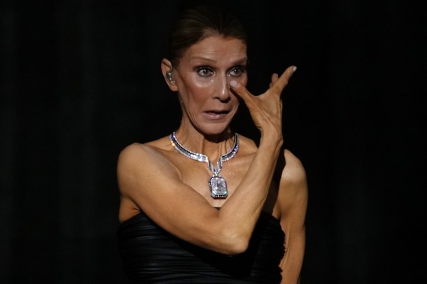 Singer Celine Dion reacts during the opening concert of her “Celine Dion Paris 2026” residency at the Plenitude Arena in Nanterre, France, outside Paris, Saturday, Sept. 12, 2026. (AP Photo/Aurelien Morissard)