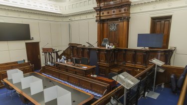 The Supreme Court jury sits in the body of the court, while the lawyers have been moved up to the side. 