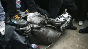 Protesters pull down a statue of slave trader Edward Colston during a Black Lives Matter protest rally in Bristol.