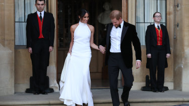 The newly married Duke and Duchess of Sussex, Meghan Markle and Prince Harry, leaving Windsor. Her second wedding dressed with designed by Stella McCartney.