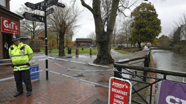 A police officer at a cordon near the Maltings in Salisbury, England, where Russian former spy Sergei Skripal and his daughter Yulia were found on a bench after they were attacked with a nerve agent.