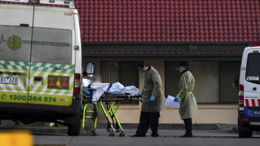 A patient is removed from St Basil's Homes for the Aged in the Melbourne suburb of Fawkner on July 25.