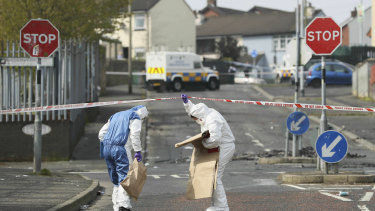 Police forensic officers at the scene in Londonderry, Northern Ireland.