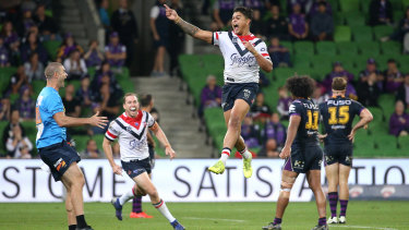 Walking on air: Latrell Mitchell breaks the deadlock for the Roosters.