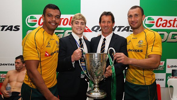 Kurtley Beale, James O’Connor and Quade Cooper with Wallabies coach Robbie Deans after winning the 2011 Tri Nations trophy. 