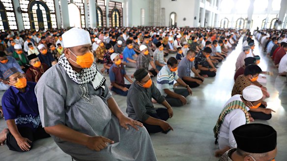 Men are spaced one metre apart during Friday prayers Al-Akbar mosque in Surabaya, East Java. 