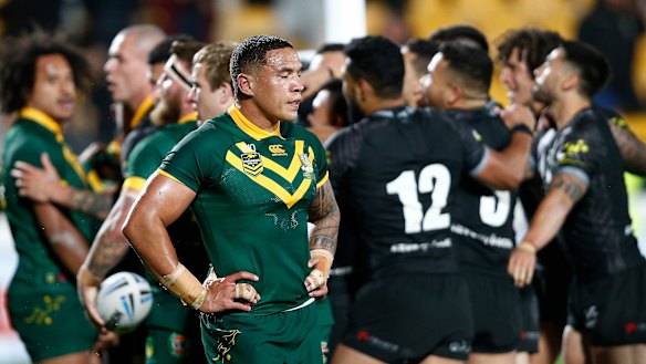 Eyes wide shut: Tyson Frizell can't look  as the Kiwis celebrate another try.