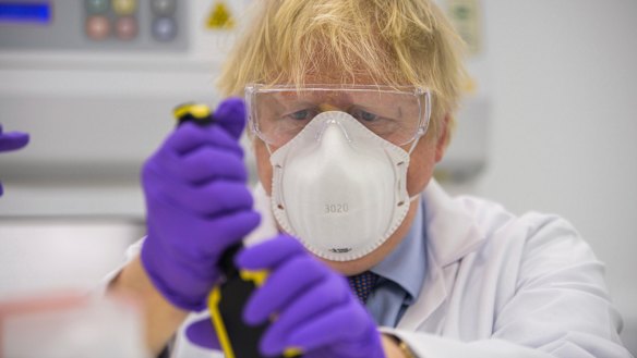 British Prime Minister Boris Johnson visits the lab of French biotechnology firm Valneva in Livingston, Scotland.