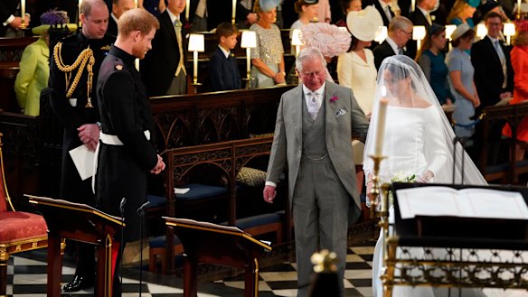 Meghan Markle accompanied by Prince Charles.