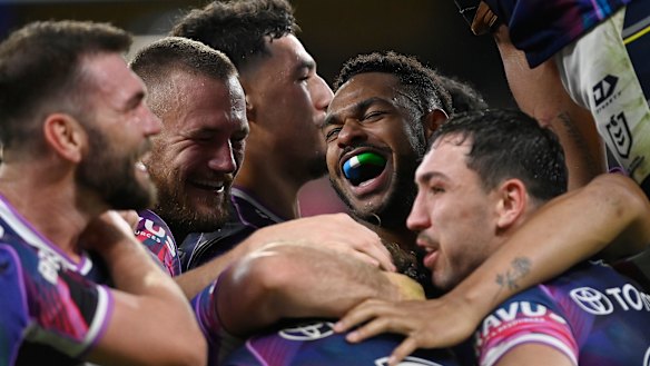 The Cowboys celebrate the win that kept them in outright second on the NRL ladder.