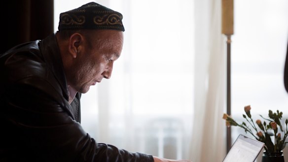 Omir Bekali looks at a computer to trace the location of the Chinese internment camp where he was held.