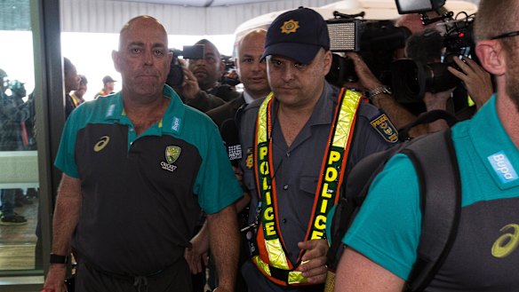 Australia coach Darren Lehmann is mobbed by cameras as the team travel from Cape Town to Johannesburg.