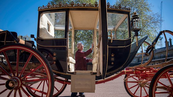 Martin Oates polishes the Scottish State Coach at the Royal Mews at Buckingham Palace. The carriage will be used if it's raining. If it's sunny, an open-top carriage will be used to transport the happy couple.