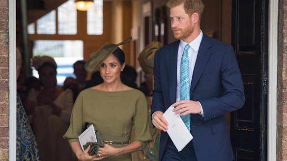 Harry and Meghan, Duchess of Sussex, leave after the christening service.