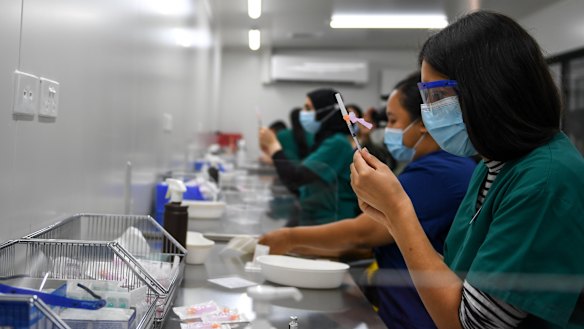 Pfizer vaccine doses being prepared at the Western Health Sunshine Hospital COVID-19 vaccination hub in March.