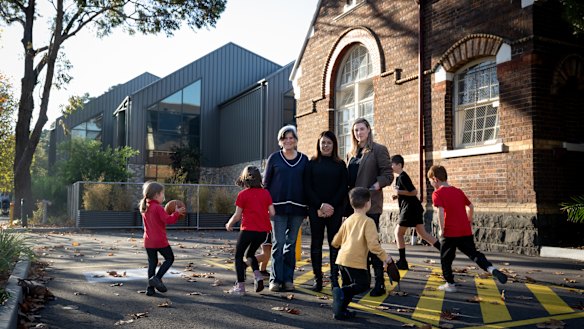 St Kilda Primary School grandparent Jenny Brew, and parents Caroline Thornton and Selina Ife with their children and grandchildren. The school has been promised a replacement hall, but it remained unfunded.