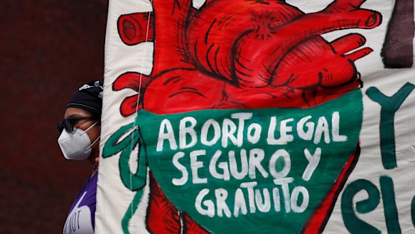 A woman holds a banner reading, in Spanish, “Legal, safe, and free abortion, legalise and decriminalise abortion now, for the independence and autonomy of our bodies,” as abortion-rights protesters demonstrate in front of the National Congress in 2020.