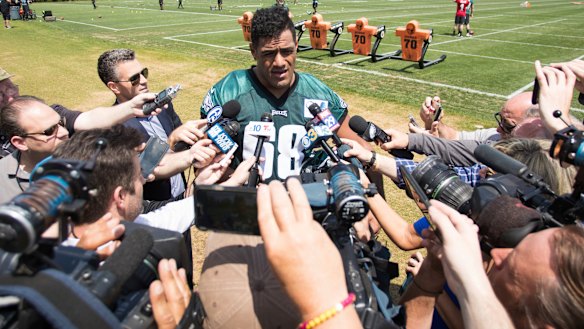 Centre of attention: Jordan Mailata is tackled by a media scrum after making the Eagles' final roster.