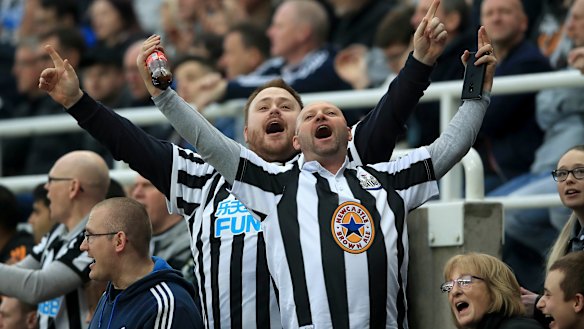 Long-suffering: Newcastle fans show their support.