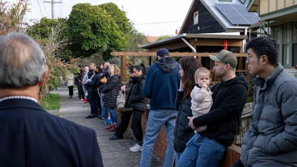 Prospective home buyers at an auction in Brunswick.