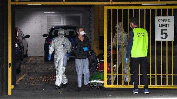 Contractors and a guest leaving the Rydges on Swanston back in July.