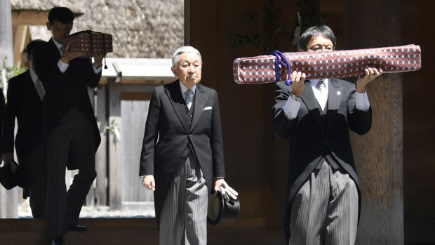 Japanese Emperor Akihito, centre, visits Ise Grand Shrine on Thursday. This is the last trip to a local region for the Emperor and Empress before his abdication.