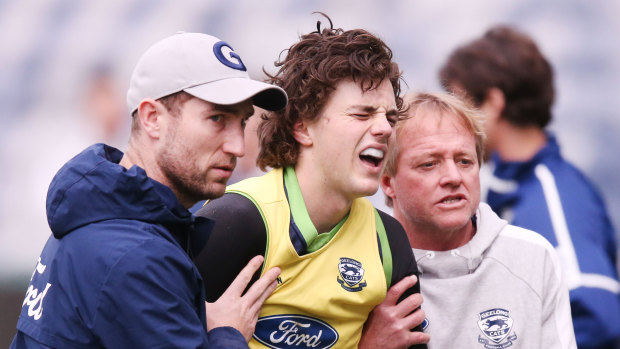 Jordan Clark is helped off the field after suffering an injury at training on Wednesday.