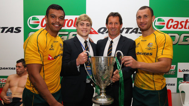 Kurtley Beale, James O’Connor and Quade Cooper with Wallabies coach Robbie Deans after winning the 2011 Tri Nations trophy. 