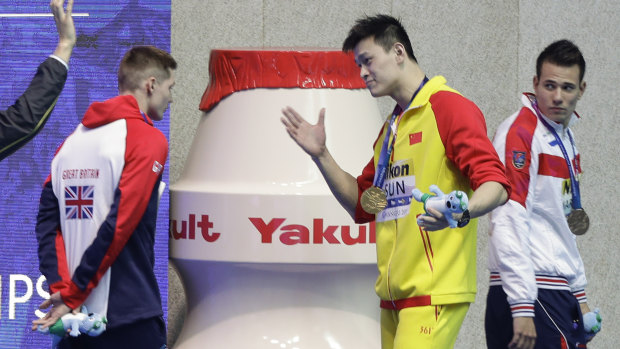 Gold medalist China's Sun Yang confronts  Britain's Duncan Scott after a medal ceremony at the world championships.   