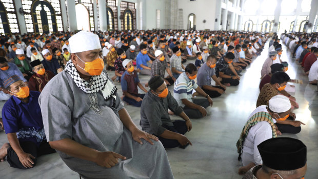 Men are spaced one metre apart during Friday prayers Al-Akbar mosque in Surabaya, East Java. 